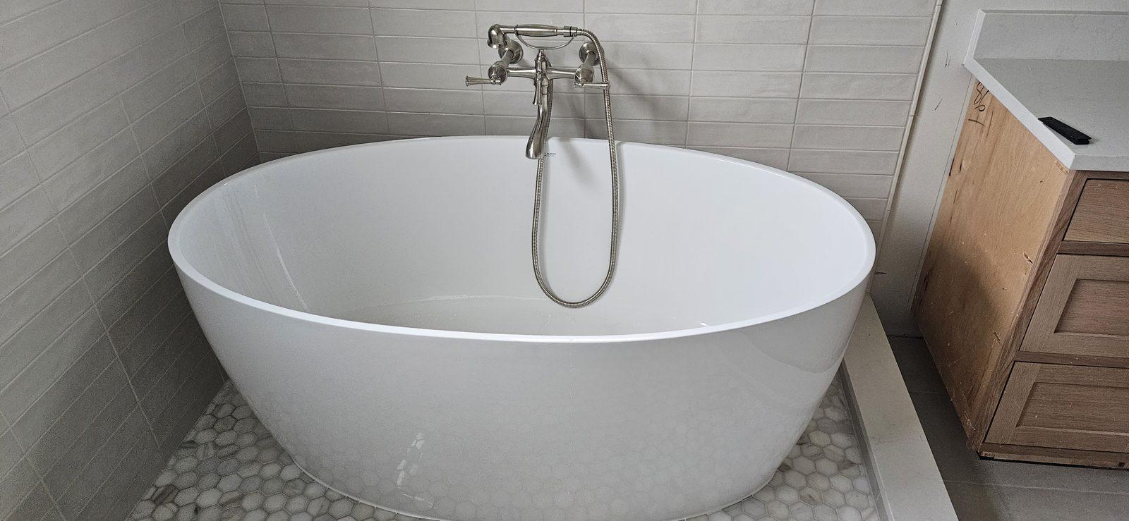 Freestanding tub in a finished bathroom remodel