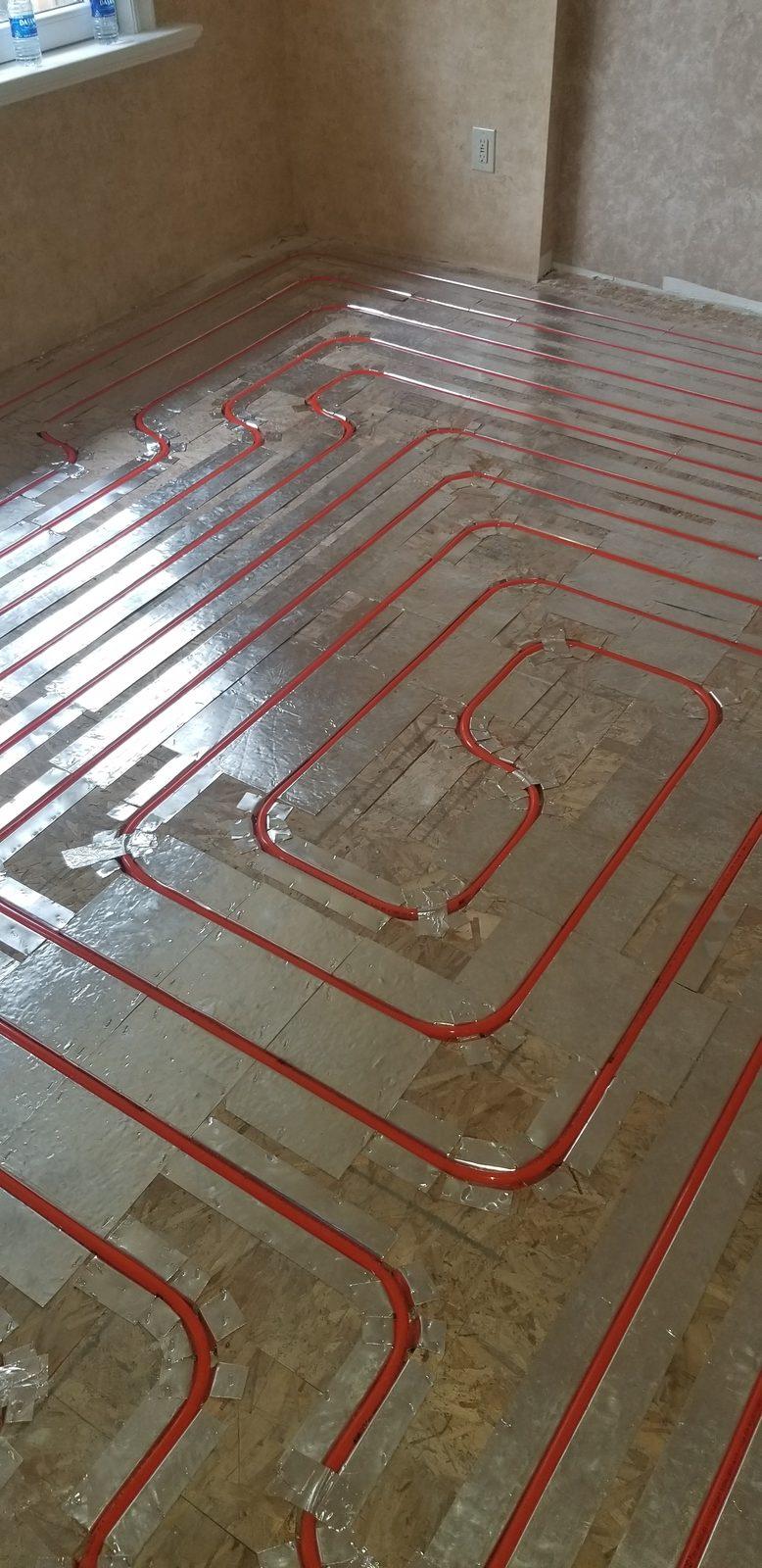 Radiant floor loops laid out before the pour