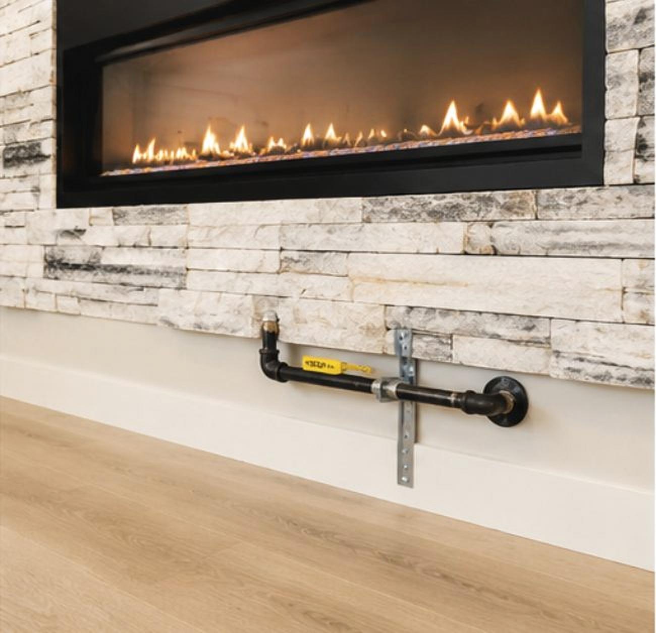 Finished linear gas fireplace fed by a new gas line