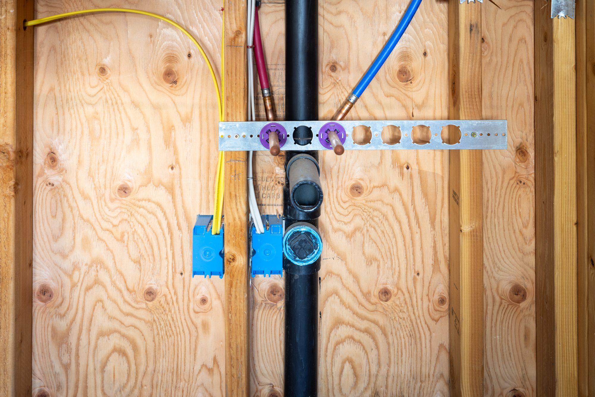 Plumbing repair work under a sink