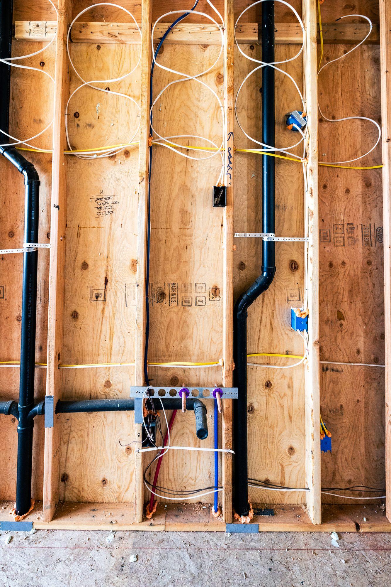Close-up of copper and PEX pipe work on an International Plumbing job