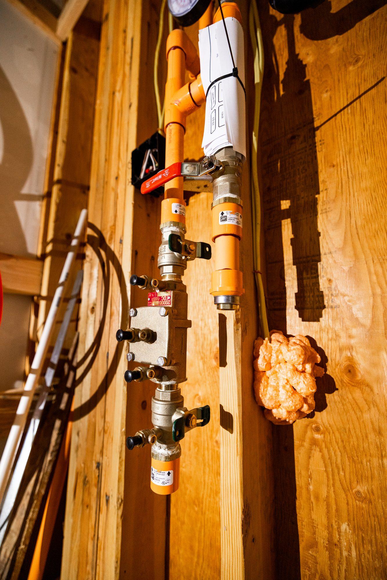 Plumber checking a newly installed water heater